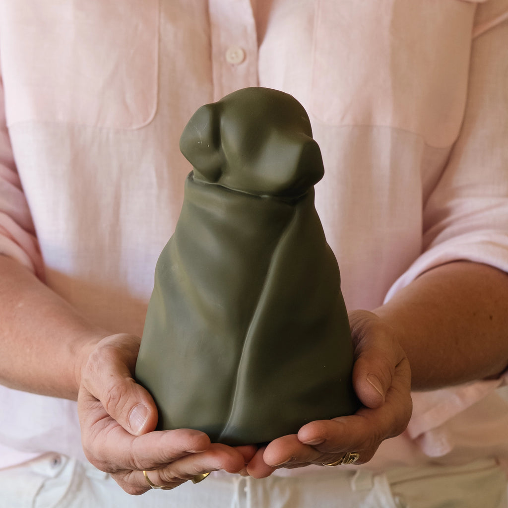 Green resin dog in blanket memorial urn — Rest By Me