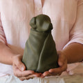 Green resin dog in blanket memorial urn — Rest By Me